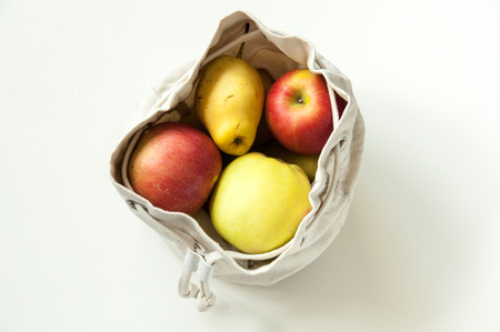 Eco-friendly cotton bags for storing fruits and vegetables. We save the nature. Proper storage of food.の写真素材