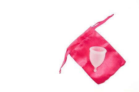 Eco-friendly hypelergenic gynecological silicone menstrual cup for women. Hygienic silicone bowl for collecting menstrual blood on a white background. Save moneyの写真素材