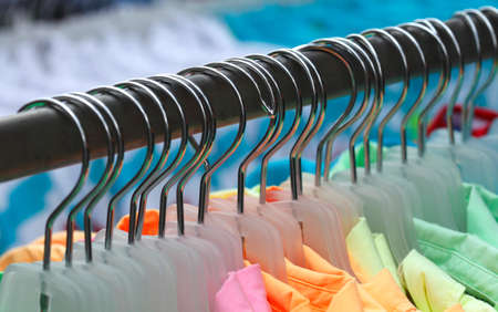 T-shirts on a clothes railの写真素材