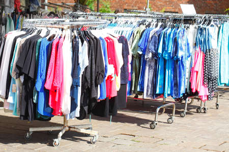 T-shirts on a clothes railの写真素材