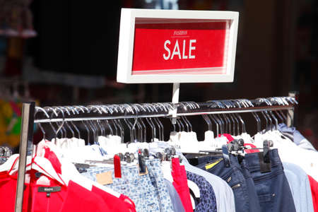 Colorful shirts on a clothes railの写真素材