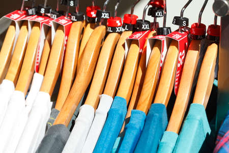 T-shirts on a clothes railの写真素材