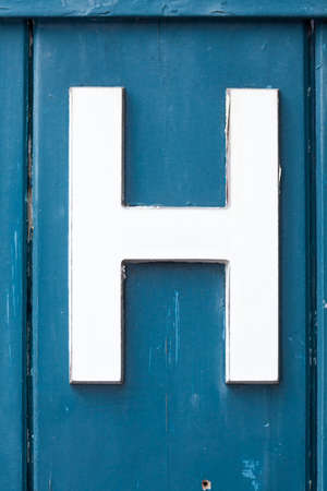 Men?s Toilet Sign on blue wooden doorの写真素材
