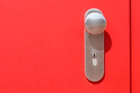 red  metal Door and silver matal door lockの写真素材