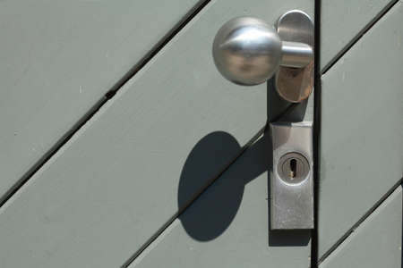 old wooden door with metal lockの写真素材