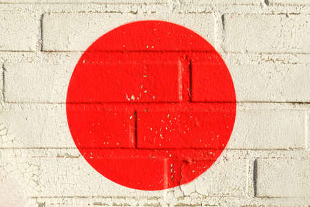 white painted brick wall, red circleの写真素材