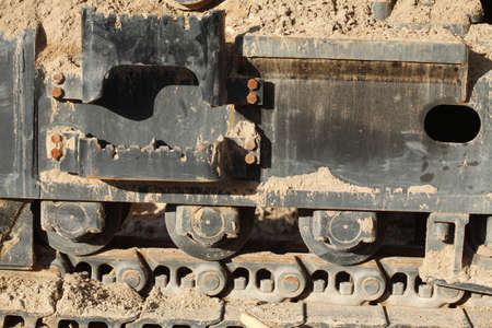 Chain Weels of an Excavator in the Sand