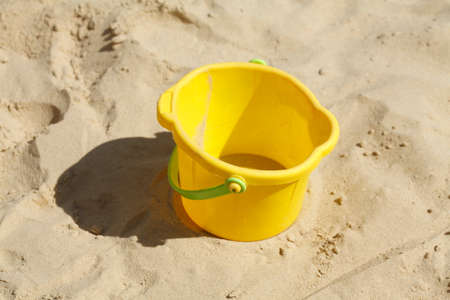 Plastic Toys in a Sandpit on a Playground for childrenの写真素材