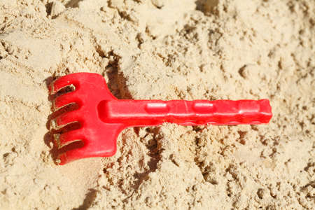 Plastic Toys in a Sandpit on a Playground for childrenの写真素材