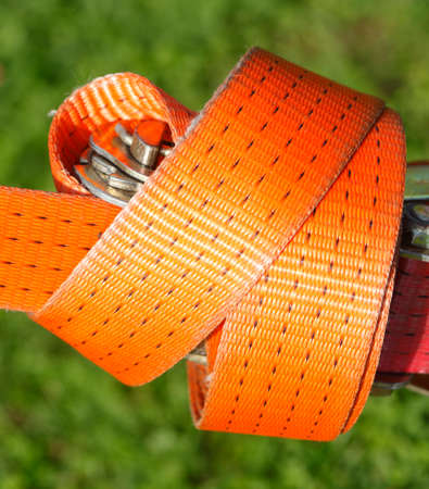 orange colored ratchet lashing strap