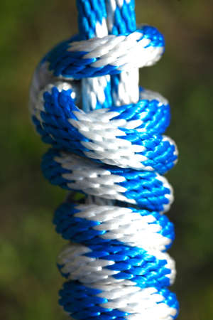 blue white colored rope with knotの写真素材