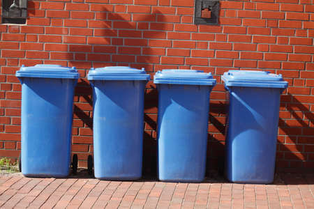 blue plastic reciyling bins for waste paperの写真素材