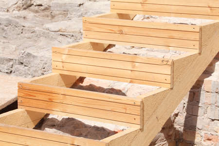 brown wooden stair on a constructin siteの写真素材