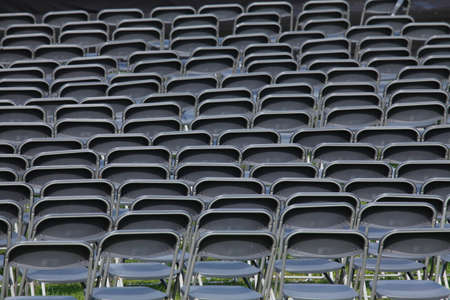 plastic chairs, grey chair row on a festivalの写真素材