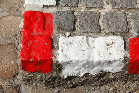 red and white colored stone  kerb on the streetの写真素材
