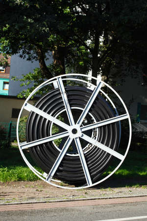 cable drum with black emty pipes