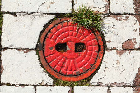 red round fire hydrant lidの写真素材