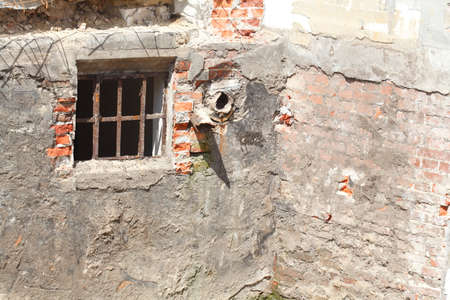 old cellar Window on an old house wall