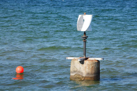 see sign buoy in the blue water
