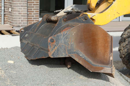 Excavator Bucket on a Construction Site with earth