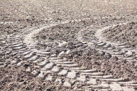 Plowed field fertilized with slurry and tire tracks, Lower Saxony, Germanyの写真素材