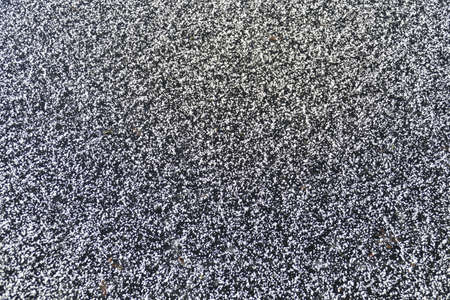 Snow grains and ice surface on a frozen lake