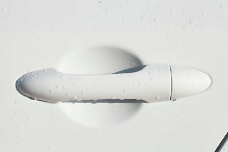 White door lock on a white car