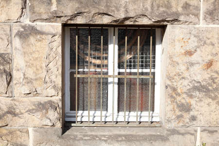 Old basement window with window grille, Germany, Europe