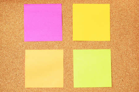 Colorful sticky notes on cork boardの写真素材