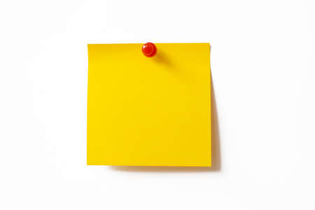 Yellow sticky note on white backgroundの写真素材