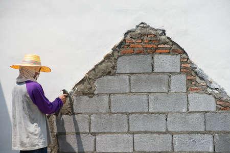 Man working on wet concrete at site construction の写真素材