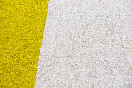 Rough yellow and white wallの写真素材