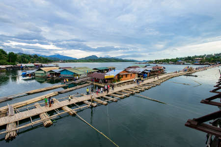 SANGKLABURI - OCT 18   The bamboo bridge is temporarily built to replace the old wooden bridge that just collapse in Sankaburi,Thailand on October 18, 2013  Sanklaburi is popular town for the tourism のeditorial素材