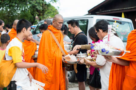 SANGKLABURI - OCT 18   Thai people donated food to the monks in Sankaburi,Thailand on October 18,...