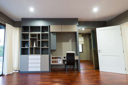 Bookshelf and the desk in modern roomの写真素材