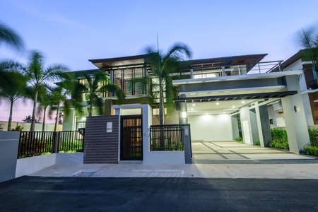 Modern house at night on windy day