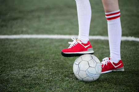 Foot on the soccer ballの写真素材