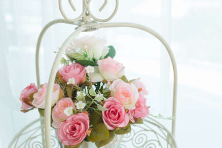 Artificial roses in the basketの写真素材