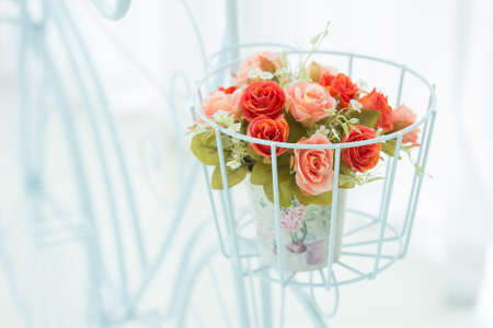 Artificial roses in the basketの写真素材