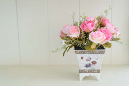 Artificial roses in the basketの写真素材