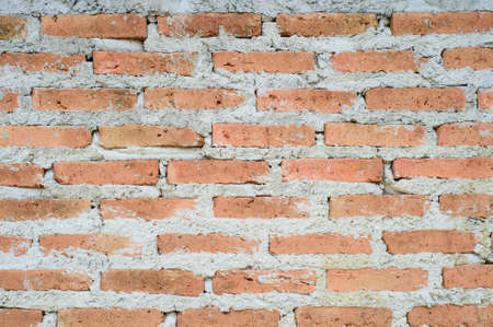 Old red brick wall, grunge backgroundの写真素材