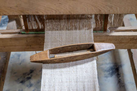 Weaving shuttle on the warpの写真素材