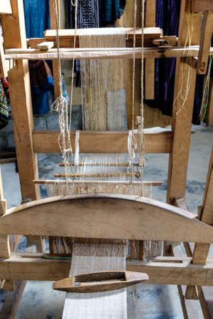 Weaving shuttle on the warp