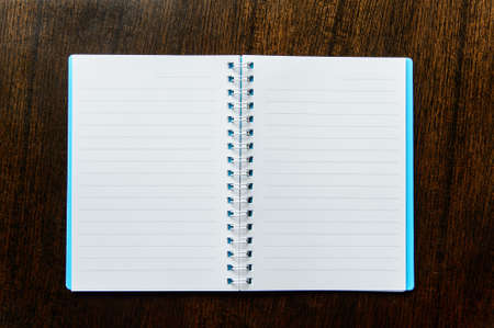 Spiral notebook on wood backgroundの写真素材