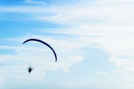 man ride Paramotor flying in the sky