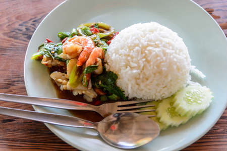Thai food : Rice with stir-fried seafood and basil.