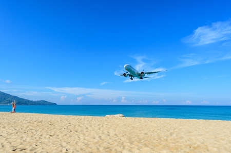 PHUKET, THAILAND - FEB 4 , 2017: Tourists are running to see the airplane landing at the beach nearby (Phuket) International Airport, south of Thailand.のeditorial素材