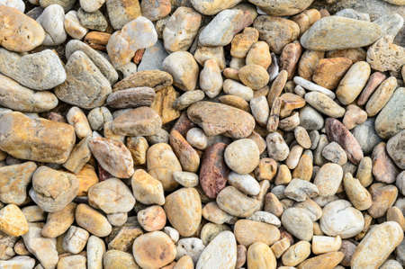 Round rocks from the beach used for background