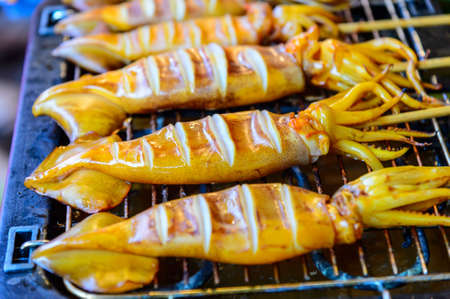 Grilled squid in Thai street marketの写真素材