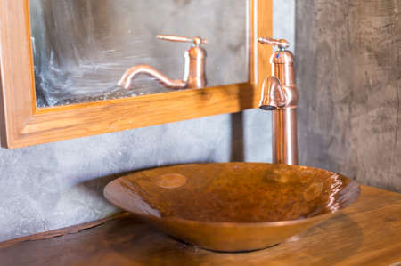Close up of classic faucet and sink in bathroomの写真素材